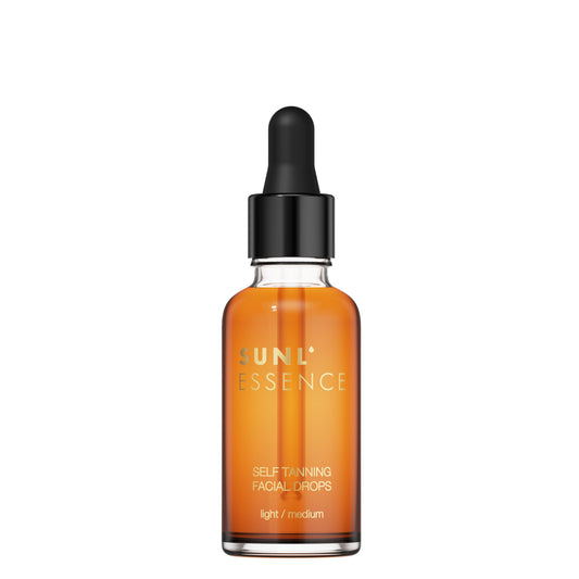 Studio product photo of a single self-tanning facial drops bottle with a black dropper cap on a white background